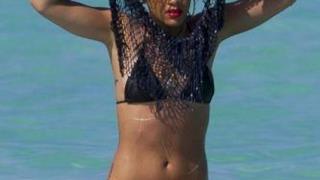 Rihanna taking of her shirt in Hawaii