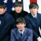 I Beatles posano davanti alla bandiera americana