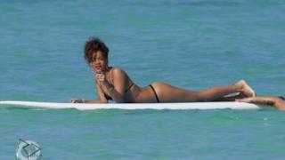 Rihanna surfing in thong