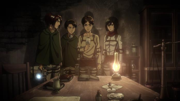 L'attacco dei giganti Eren e gli altri osservano la foto lasciata da Grisha
