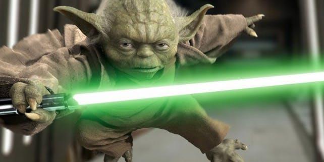 Yoda con la spada laser verde