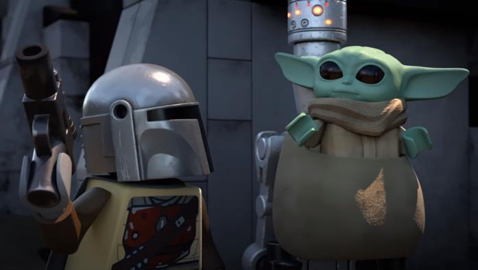 Anche i protagonisti di The Mandalorian in LEGO Star Wars Christmas Special Mando (sinistra) e Baby Yoda (destra) in una scena di LEGO Star Wars Christmas Special