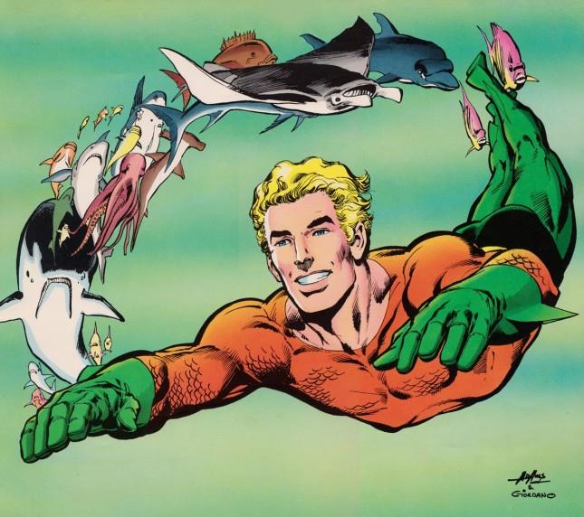Aquaman guida telepaticamente le forme di vita sottomarine Disegno di Aquaman mentre nuota seguito da molti pesci