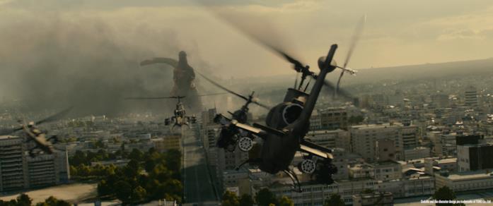 Gli elicotteri si preparano ad attaccare Godzilla che semina distruzione a Tokyo Gli elicotteri in formazione fronteggiano Shin Godzilla
