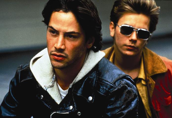 Keanu Reeves, i migliori film dell'attore Keanu Reeves e River Phoenix in una scena del film Belli e dannati