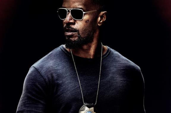 Jamie Foxx con gli occhiali scuri nei panni di Vincent Downs