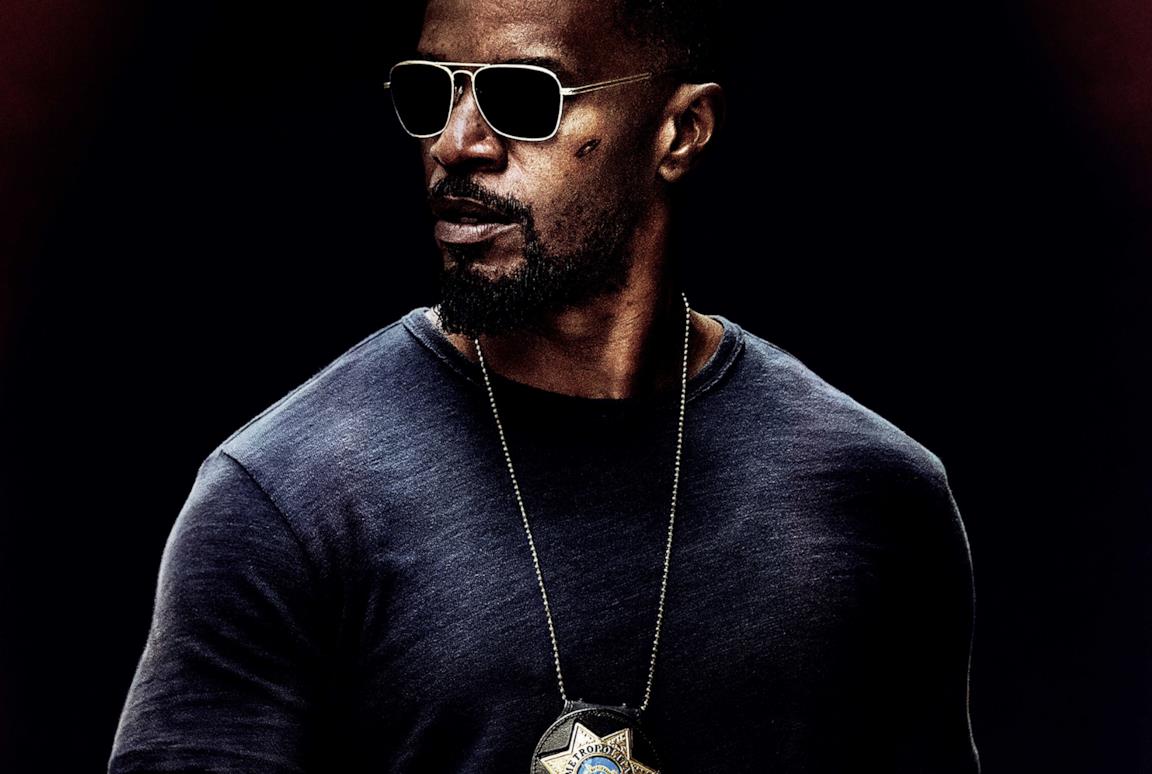 Jamie Foxx con gli occhiali scuri nei panni di Vincent Downs