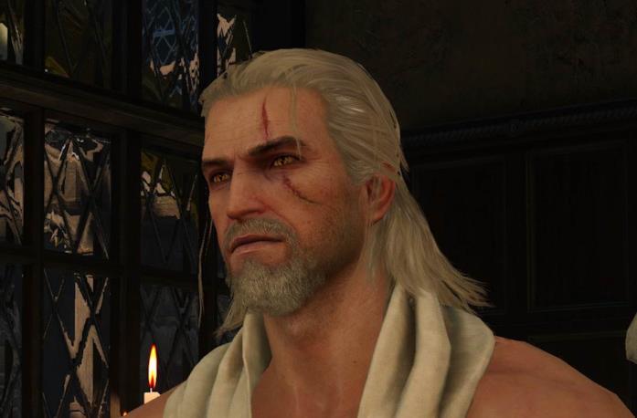 Un primo piano di Geralt di Rivia con la barba in The Witcher 3 Geralt di Rivia, protagonista della saga di The Witcher