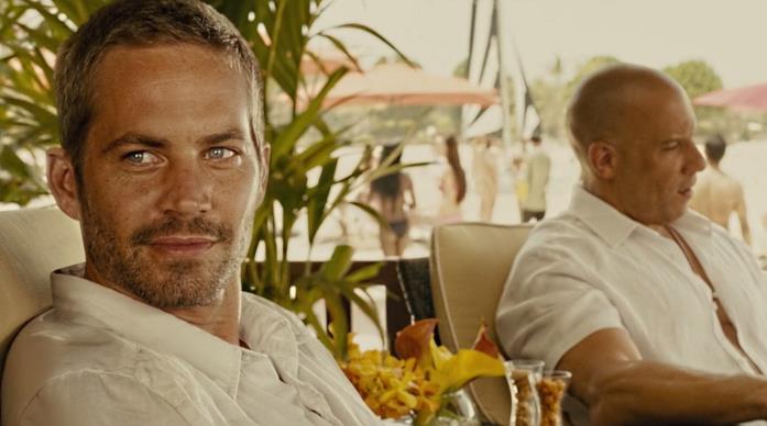 Fast & Furious 7, l'addio di Paul Walker Paul Walker e Vin Diesel in una scena del film
