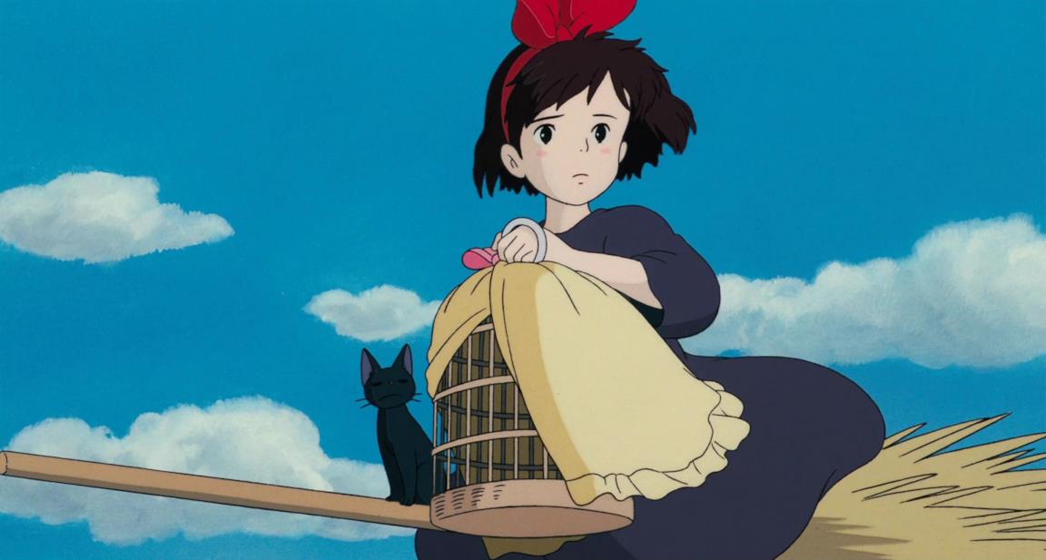 Kiki in volo sulla scopa per una consegna, insieme al gatto Jiji
