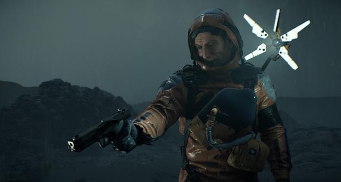 Death Stranding sarà un gioco che costruirà collegamenti tra le persone Uno dei personaggi di Death Stranding in azione con il suo braccio chirale