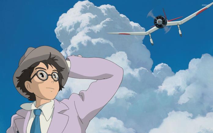 Jiro guarda un aeroplano che vola su un cielo azzurro