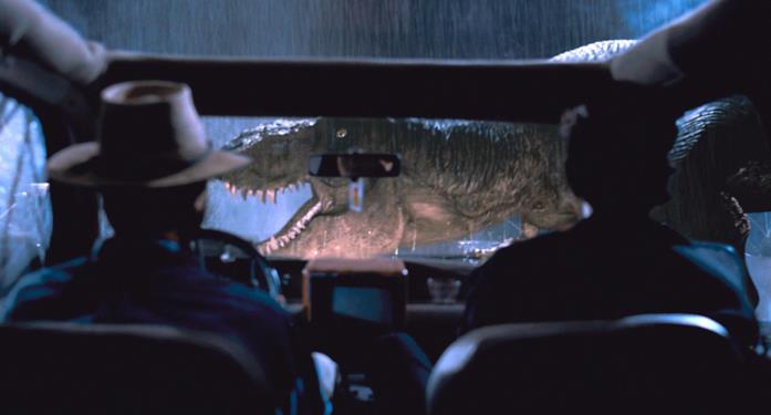 Alan Grant e Ian Malcolm assistono all'irruzione del sauro in Jurassic Park