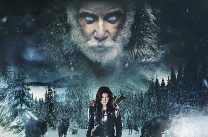 Clair Hamilton, circondata da lupi, cammina tra la neve