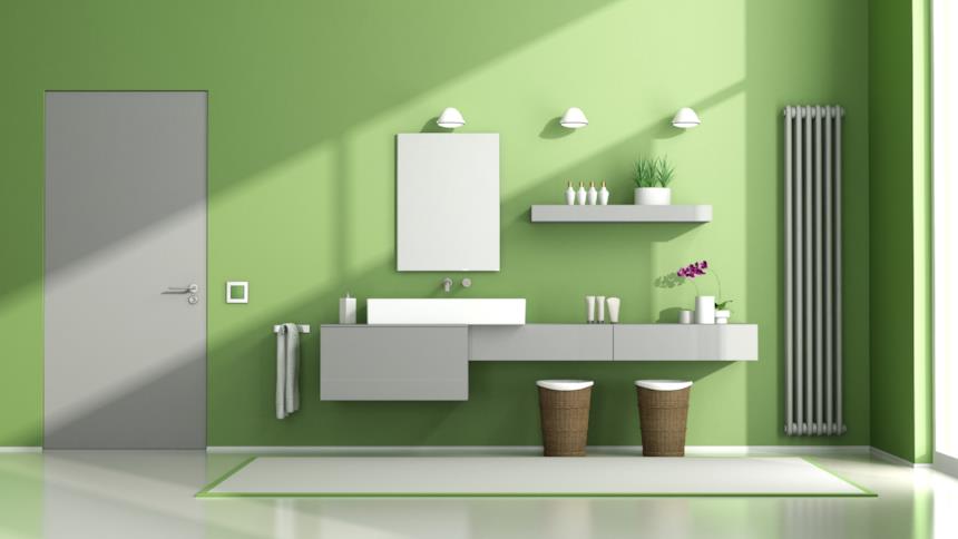 Bagno con pareti verdi e mobili grigio chiaro