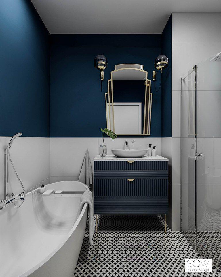 Bagno vintage con pareti e mobile blu scuro