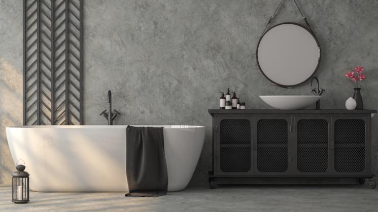 Bagno grigio con mobili neri