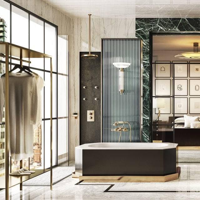 Vasca da bagno con rubinetti Gessi Venti20 color oro