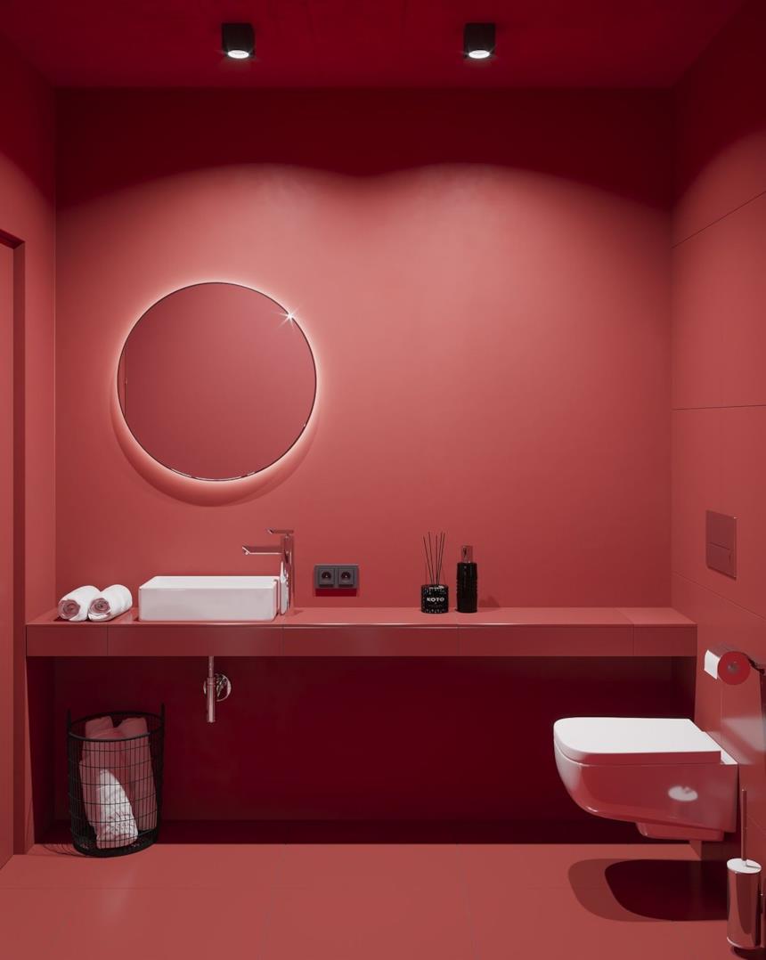 Bagno totalmente rosso con sanitari bianchi