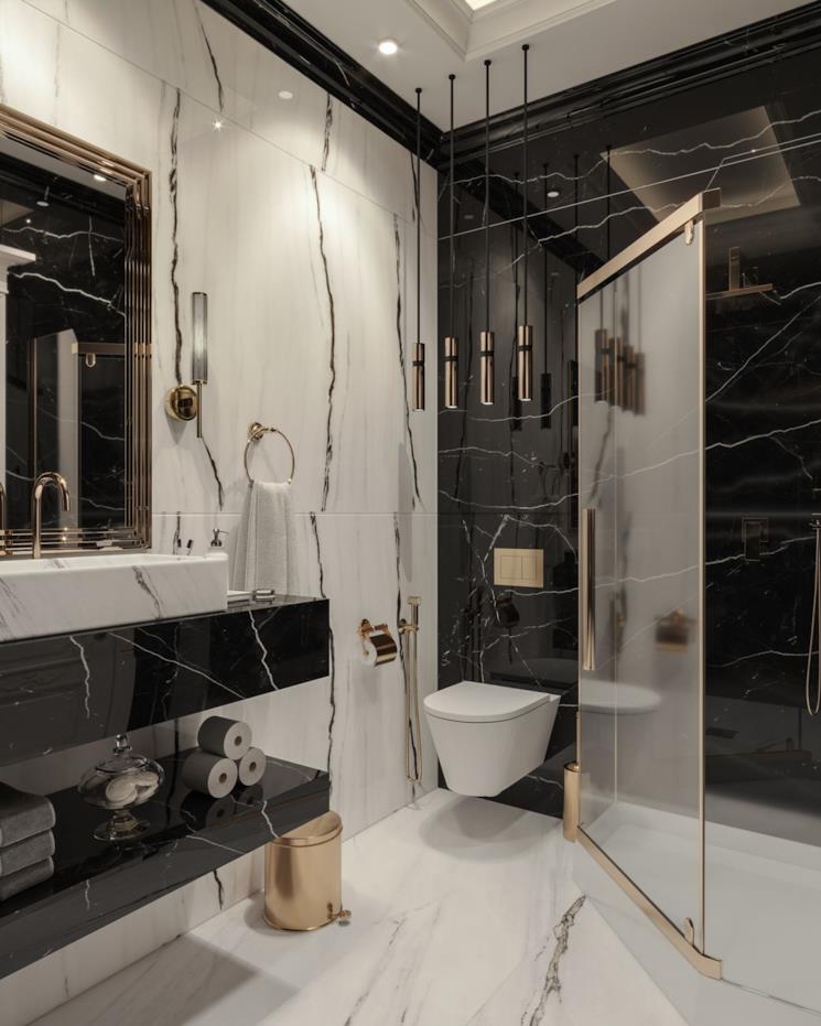 Bagno in marmo nero, box doccia e finiture in ottone