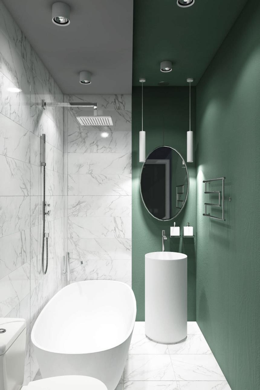 Foto di un bagno con una parete verde e i sanitari bianchi