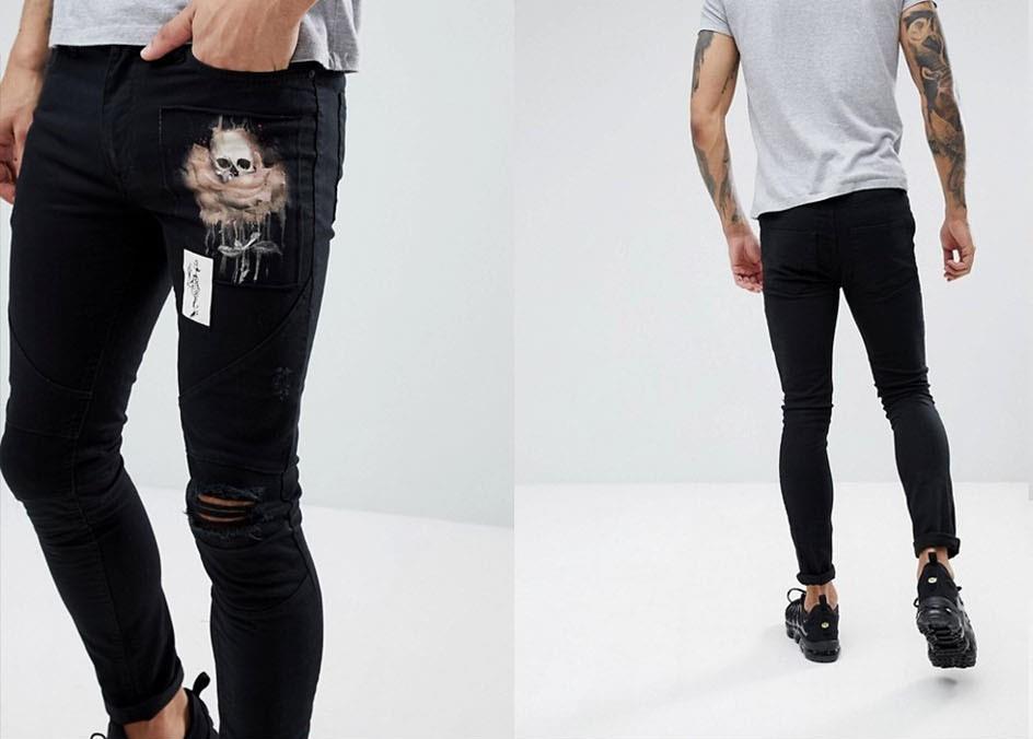 Jeans neri da uomo con strappi e toppe