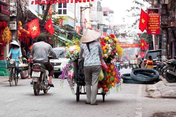 Woman selling flowers in Vietnam
