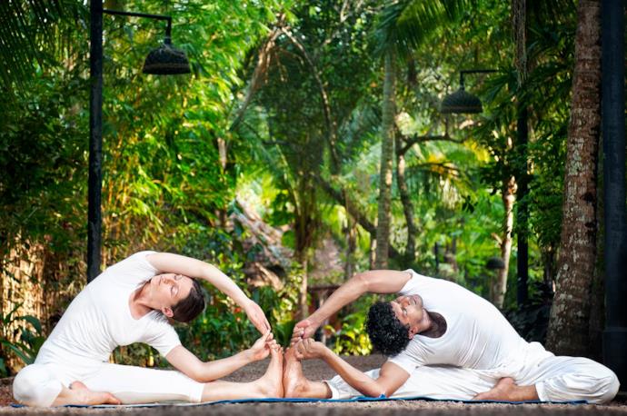 Couple practicing Acro Yoga