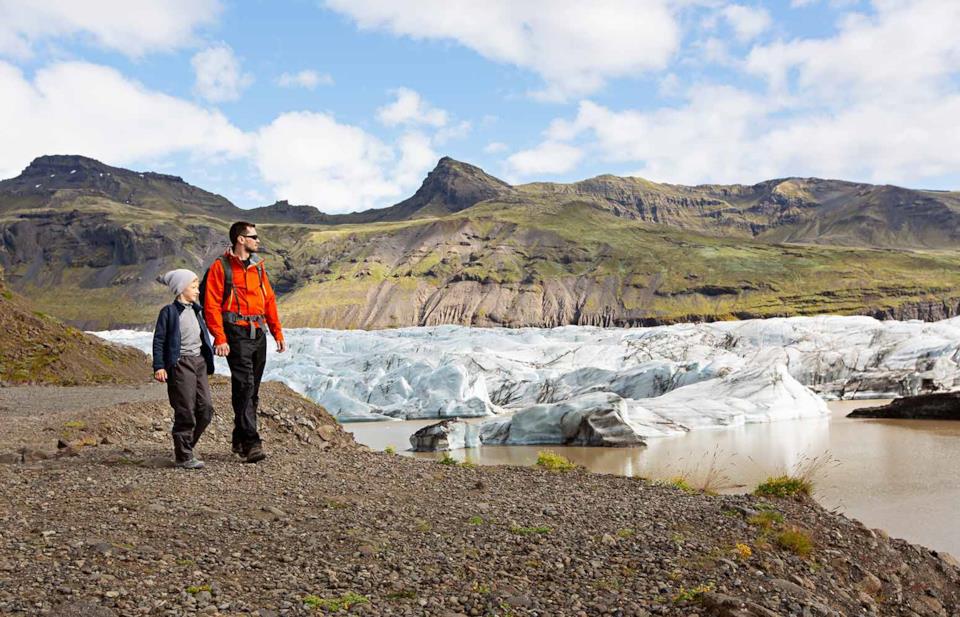 Dad and son trekking in Iceland
