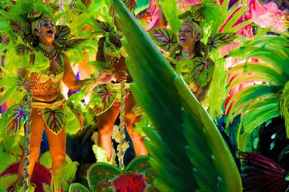 Three beautiful women in traditional brazilian carnival costumes